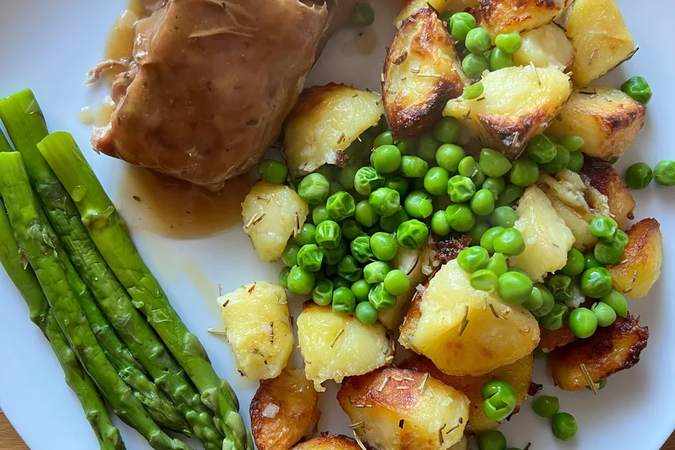 BookNoFees: Example photo: Roast pork with gravy, roast potatoes, peas and asparagus