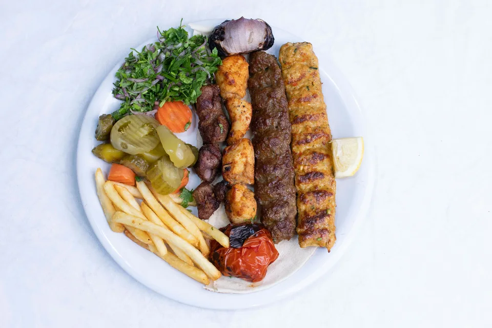 BookNoFees: Example photo: Grilled kebabs served with salad and fries